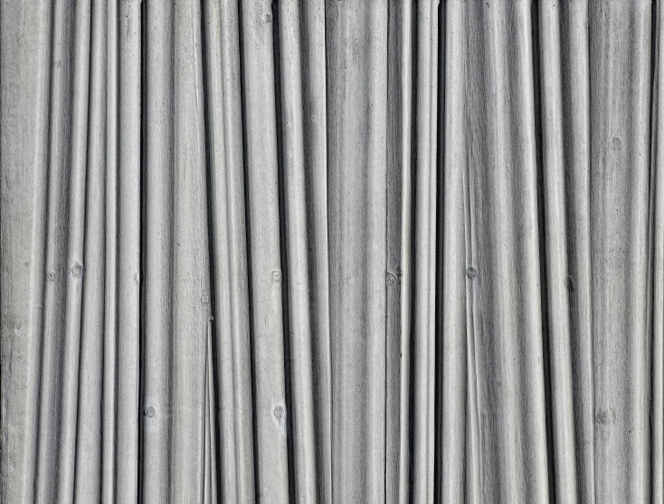 an abstract view of a metal surface with lines and ridges