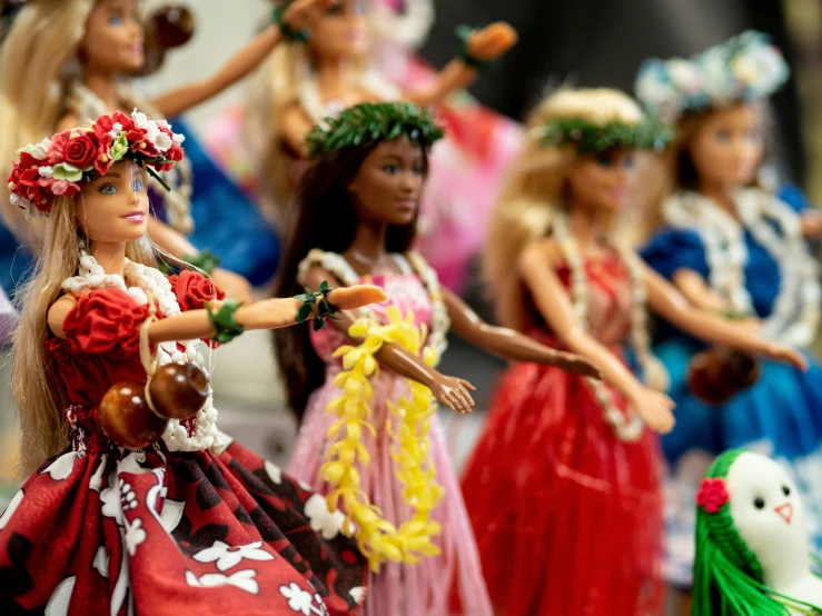 the dolls are dressed in colorful hawaiian attire