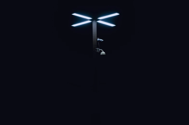 a dark lit po of a street lamp