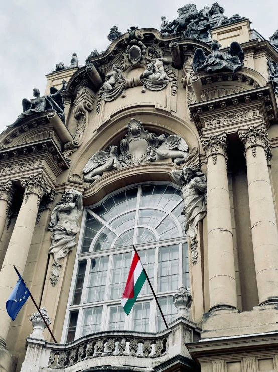 the view of an ornate building shows the window frame