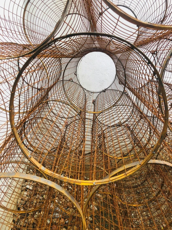 an art installation made of metal wire and some wood sticks