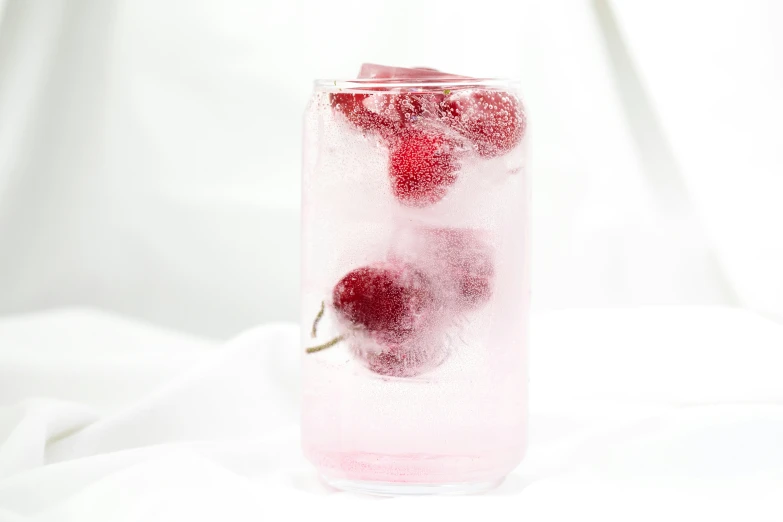 raspberry juice in a tall glass with the base being filled