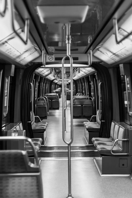 an empty bus with seating in a black and white po