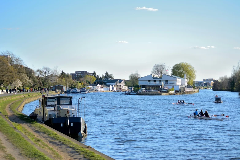 a body of water with a boat on it near some houses