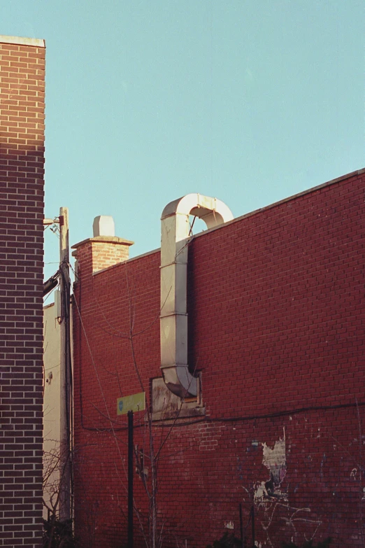 an old brick building with a large clock on the front