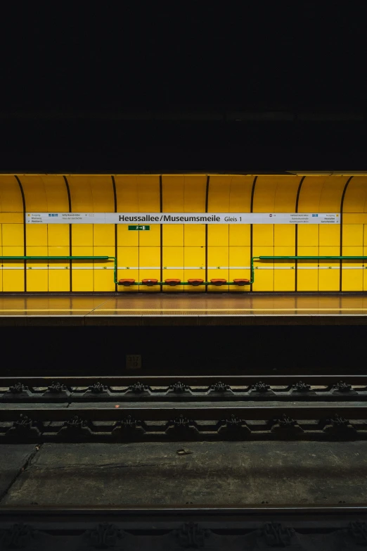 a yellow train sitting in a train station