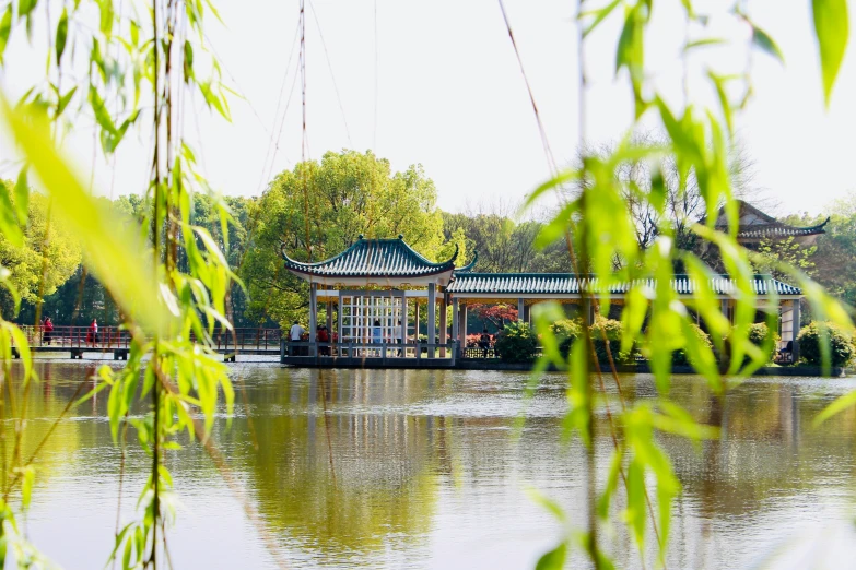 the lake is surrounded by a house and trees