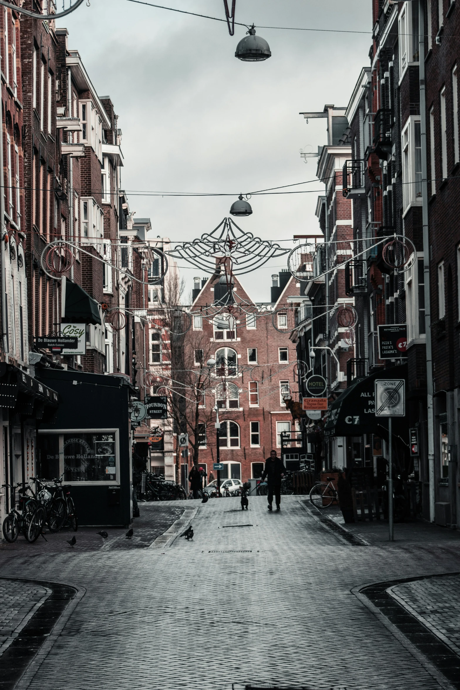 a city with cobblestone streets and tall buildings