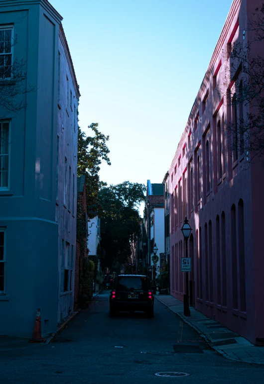 the vehicle is driving down a small street