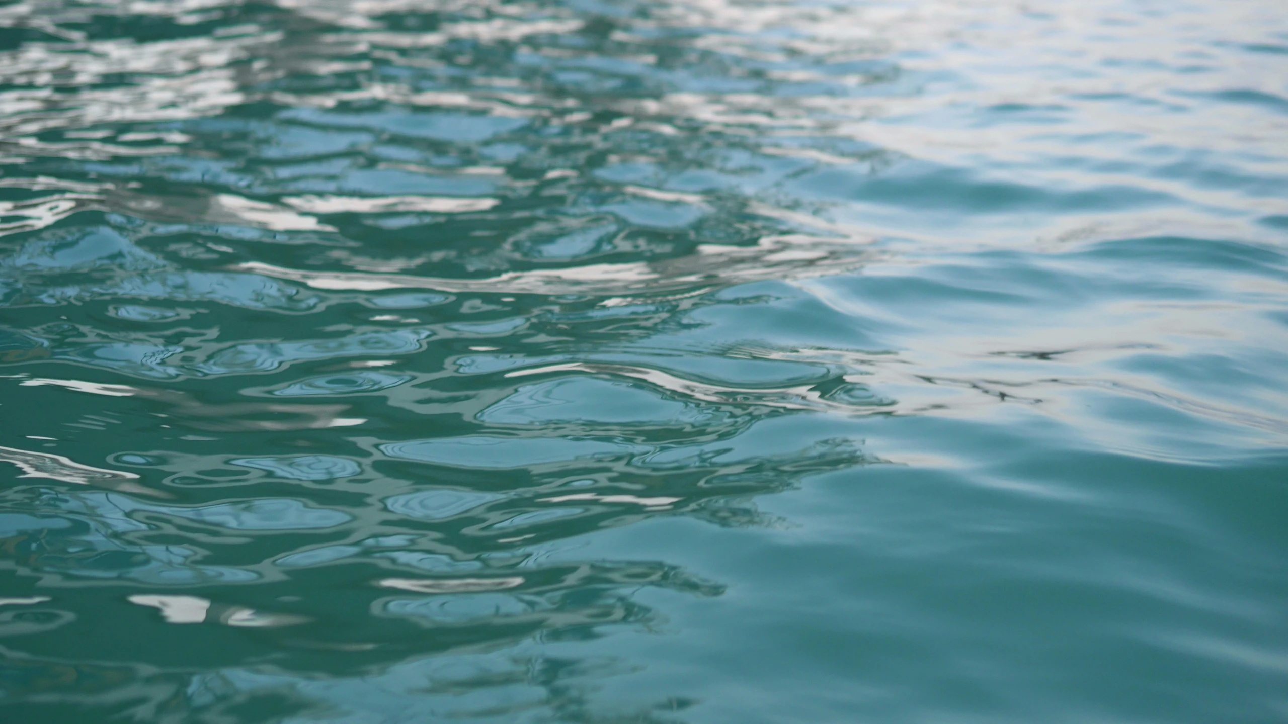 the water is crystal clear and clear as it reflects off of the surface