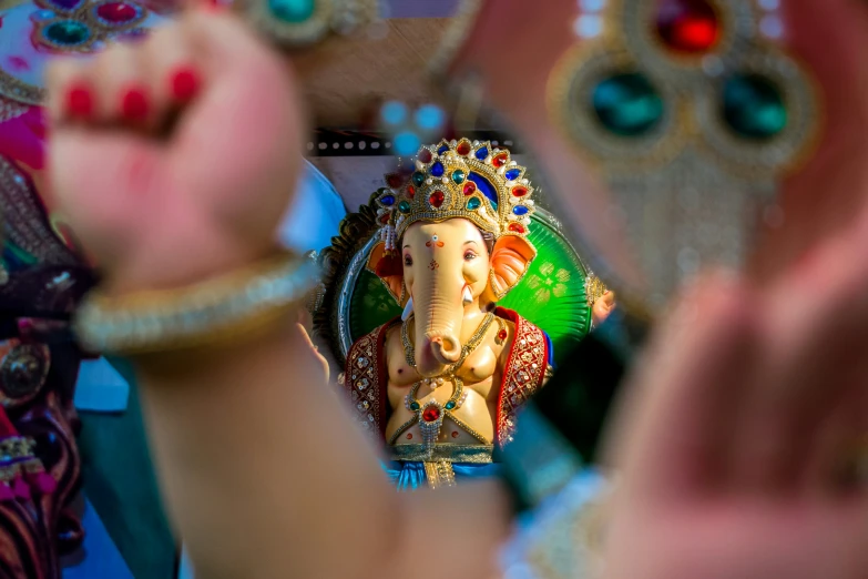 an elephant statue is standing with its trunk to the side