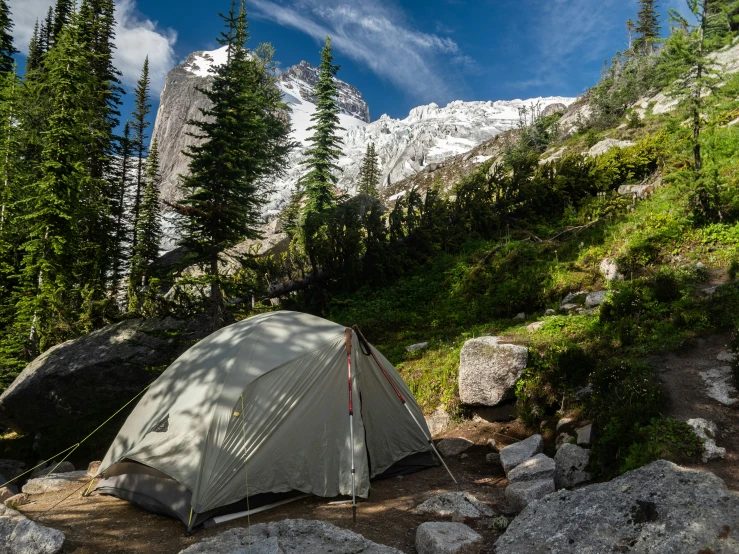 an image of camping with the mountains in the background