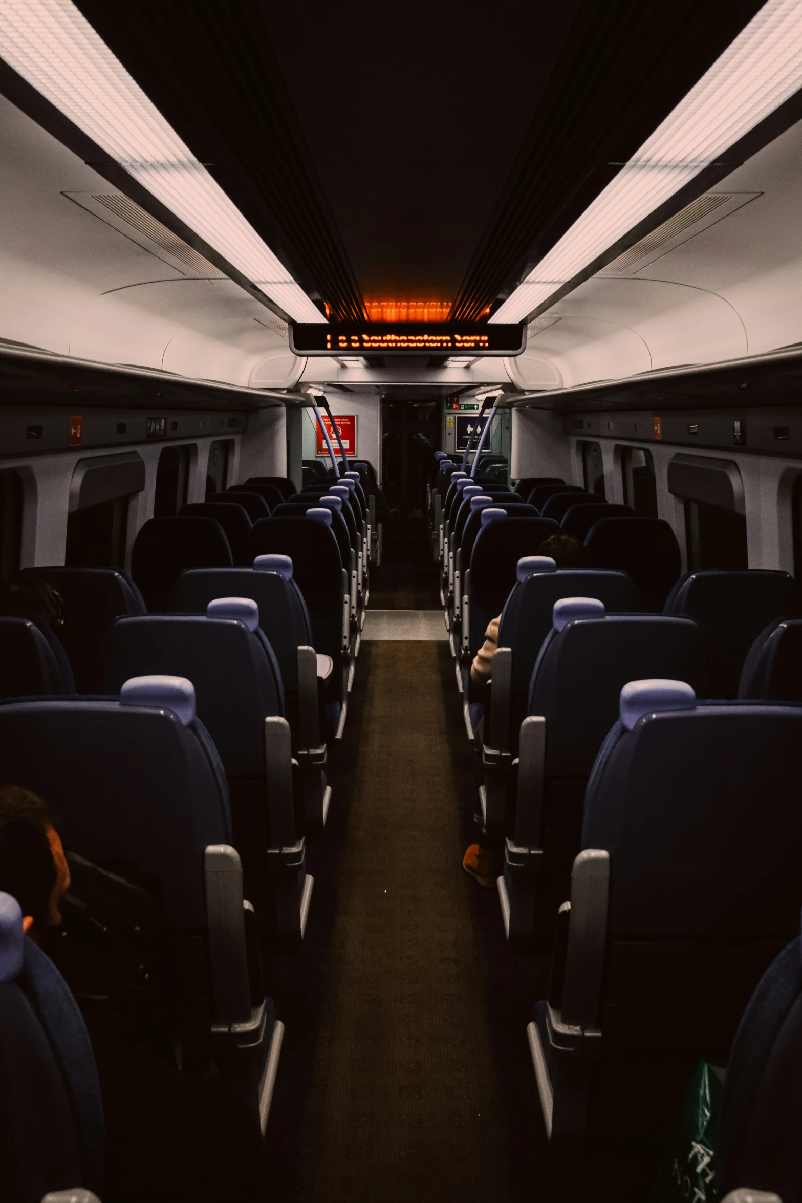 rows of seats on the interior of an airplane