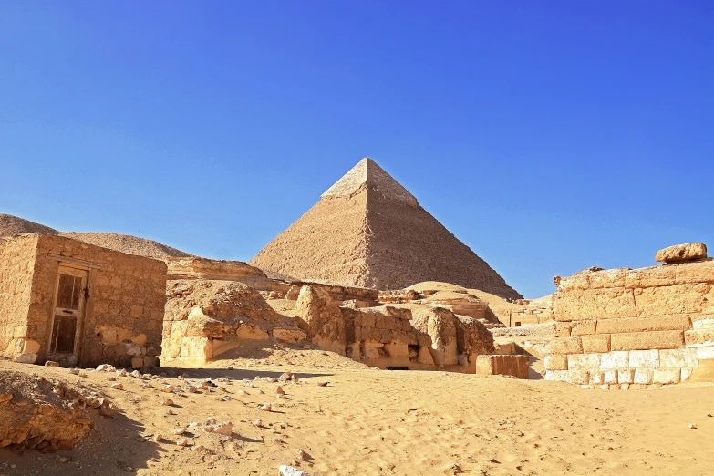 egyptian pyramids sitting in a desert landscape