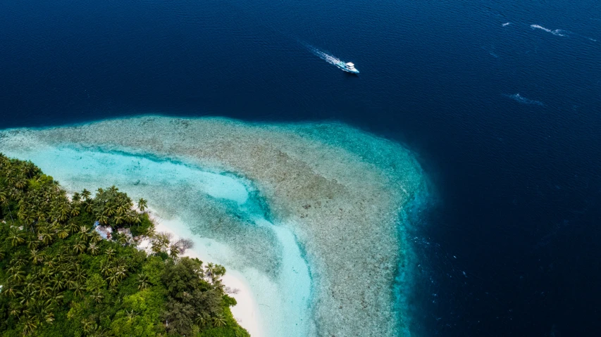 an aerial view of an island in the middle of the ocean