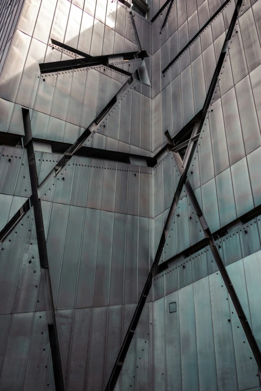 some long poles hanging in front of a building