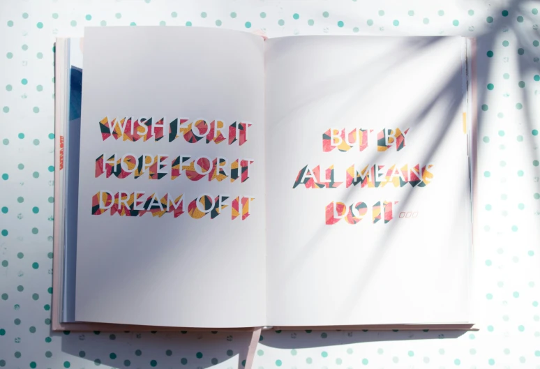 a book with an image of a rainbow writing in it