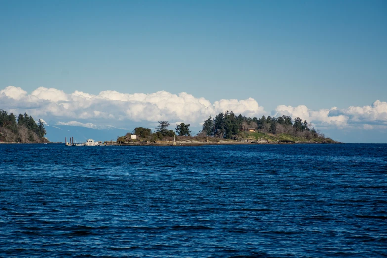 a body of water surrounded by small houses