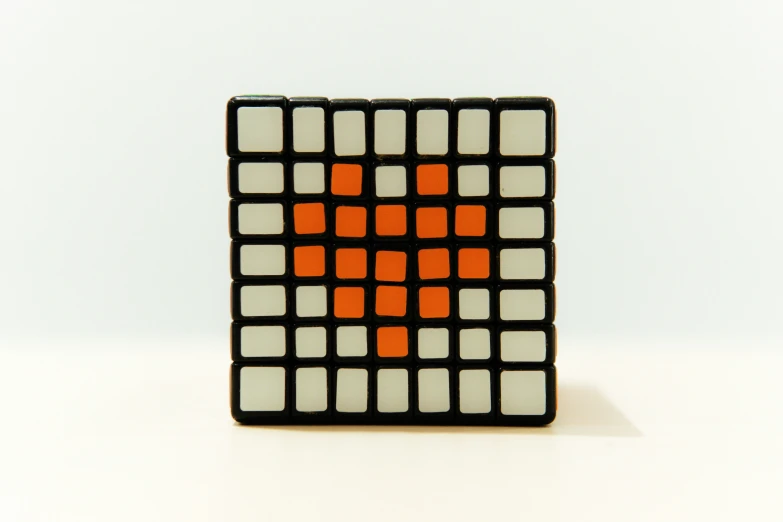 a black square with squares that appear to be white and orange