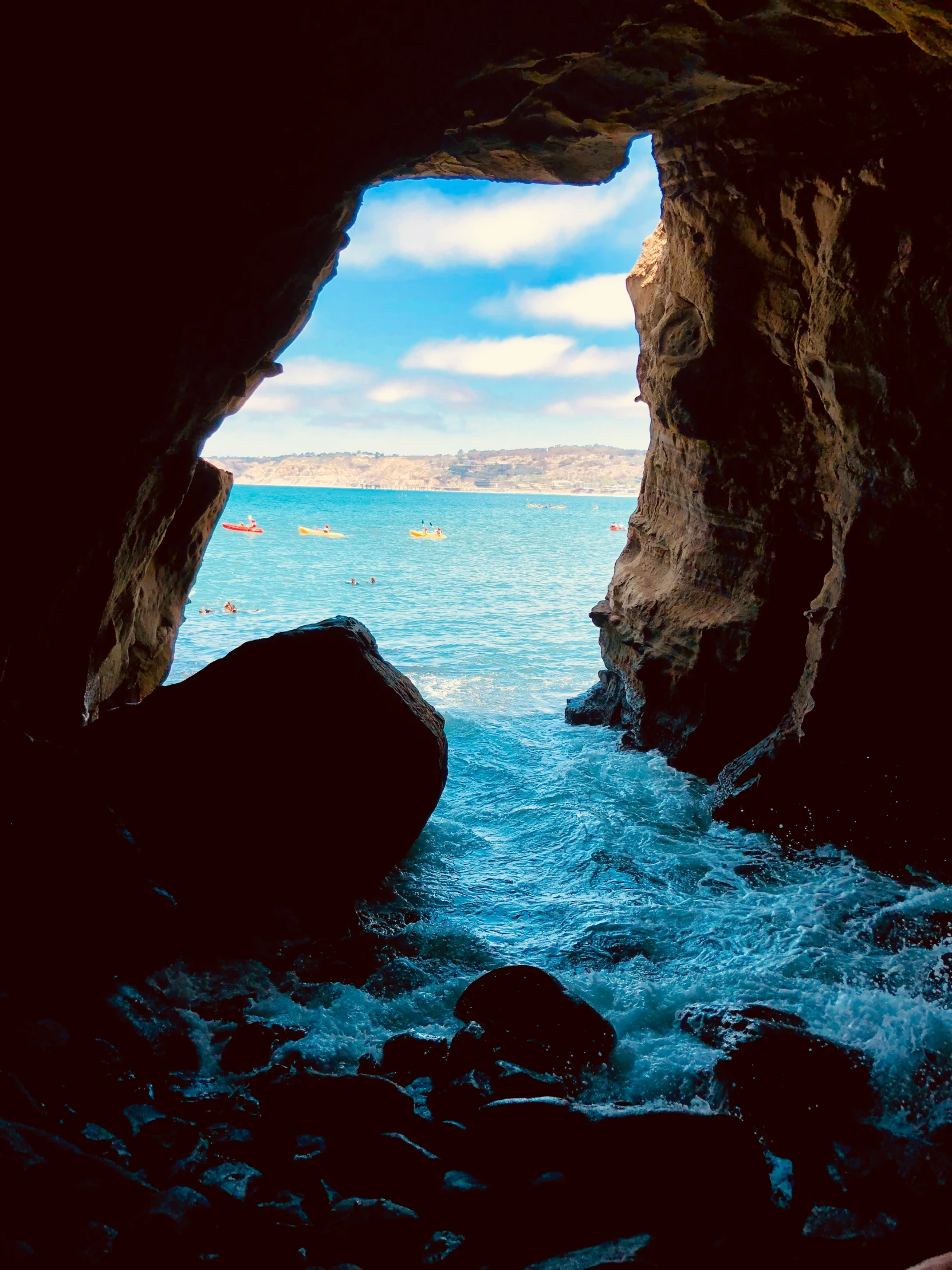 an open cavern in the side of a cliff