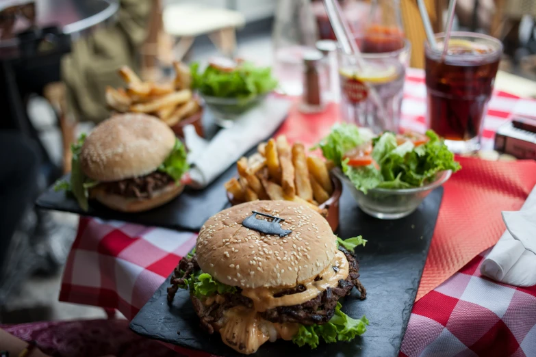 hamburgers and fries in plate on table