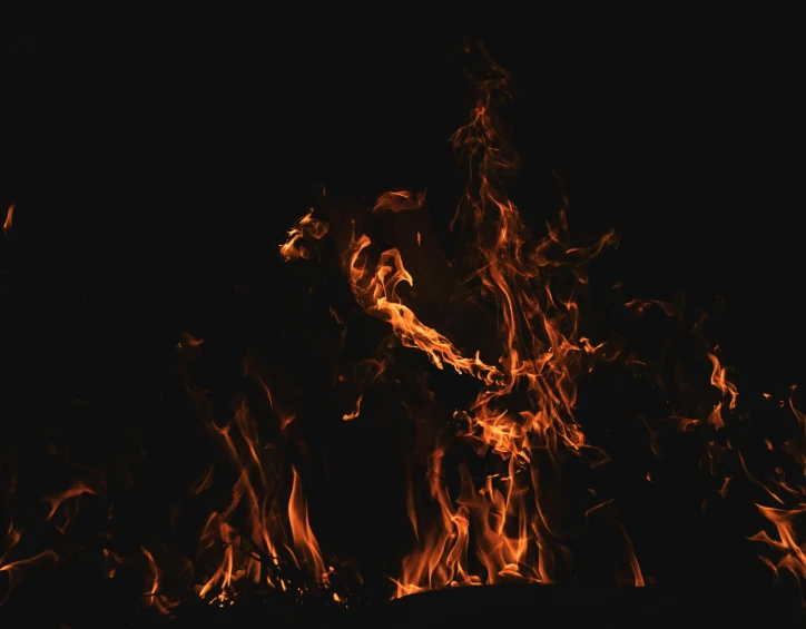 a large amount of orange flames on a black background