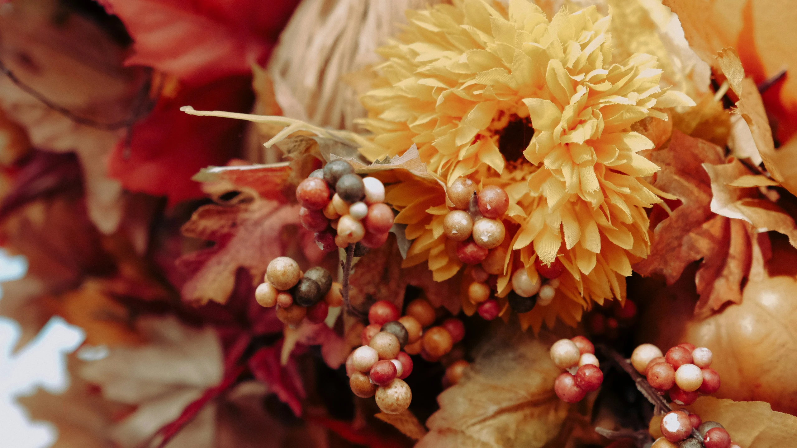 close up of colorful autumn flowers in a vase