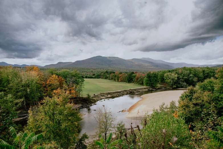 a picture of a beautiful scenery under a cloudy sky