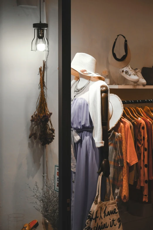 a display of a hat, purse and handbag