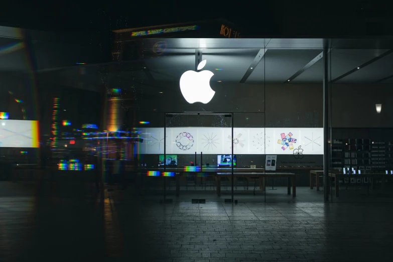 the inside of an apple store with a computer on display