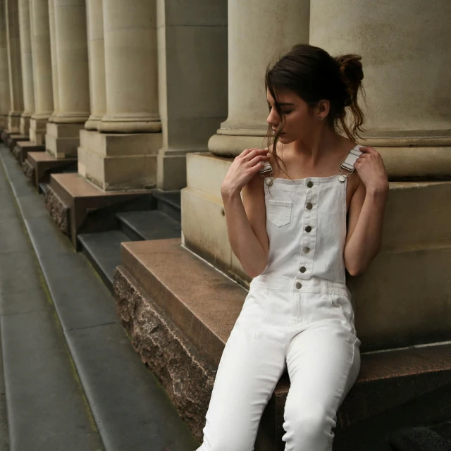 a woman is sitting on some steps with her cigarette in her mouth