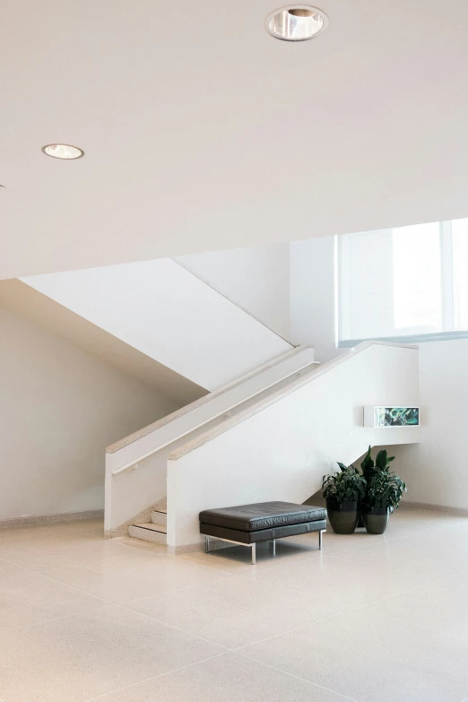 two light filled airy spaces with white walls and floor