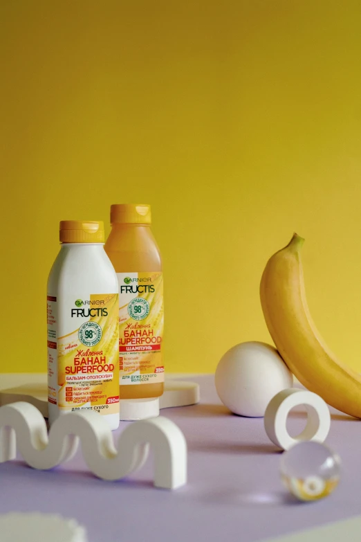 a table that has some different kinds of drinks and a banana on it