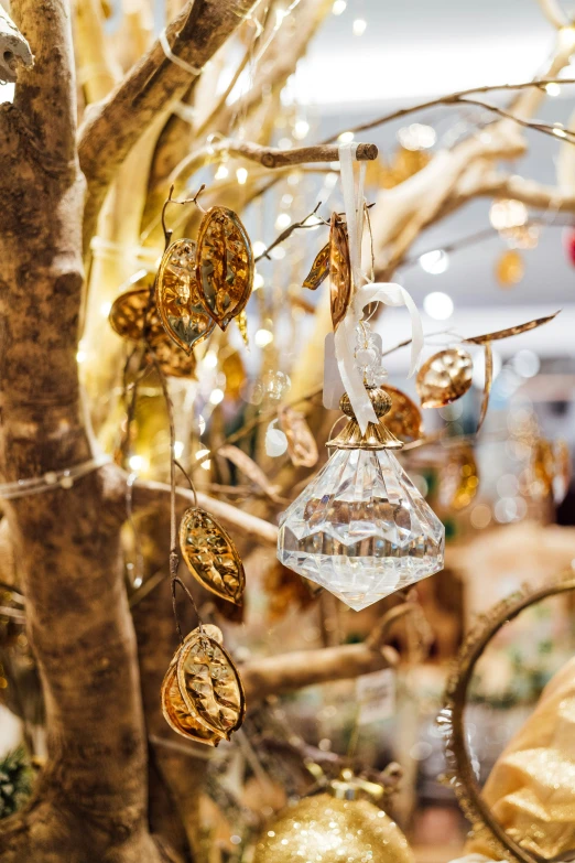 a tree in a store filled with gold ornaments