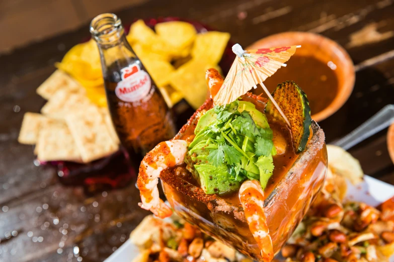 a close up view of food on a tray with a drink