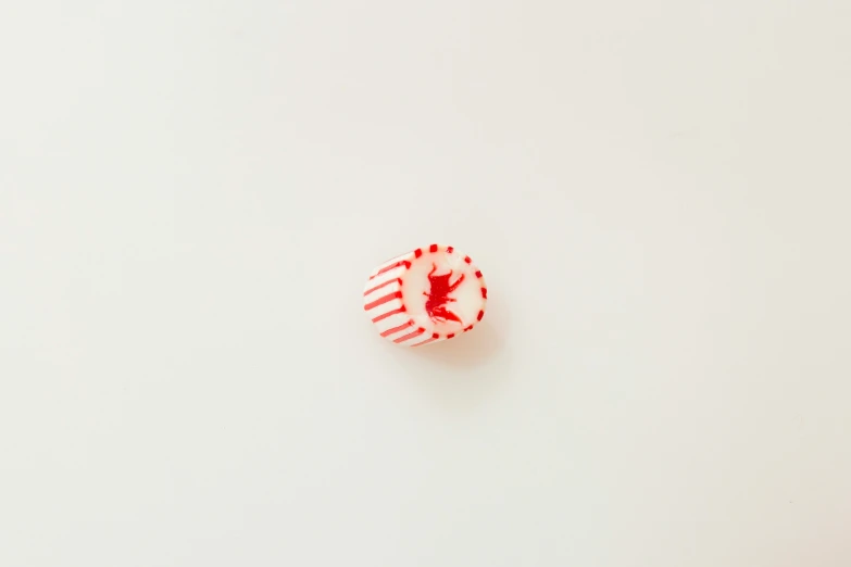 a single red and white piece of material with some markings on it