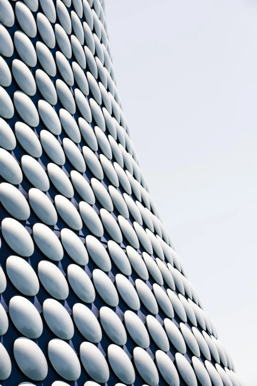 a building has white circles against a blue background