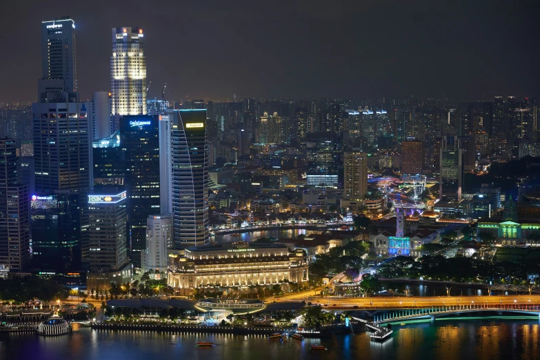 a large city filled with tall buildings next to water