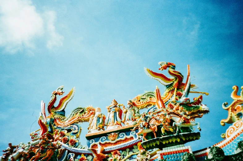 a carnival like ride is brightly colored and decorated