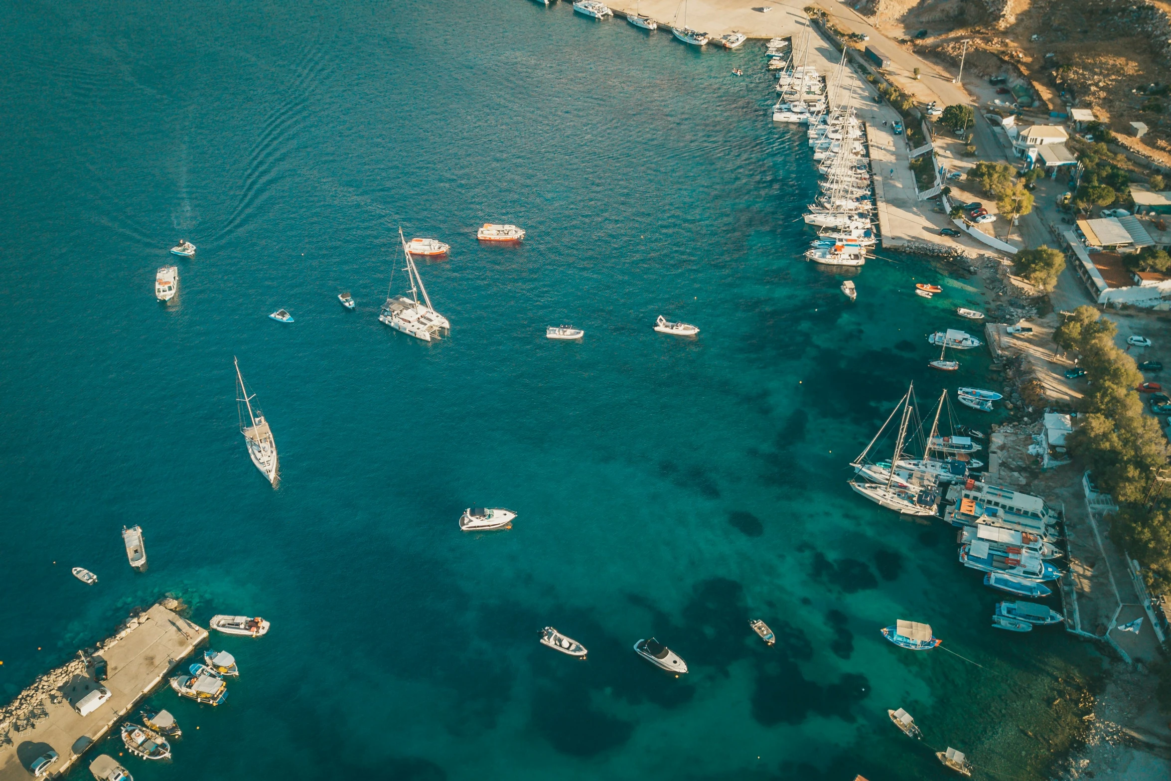 some sail boats are in the water