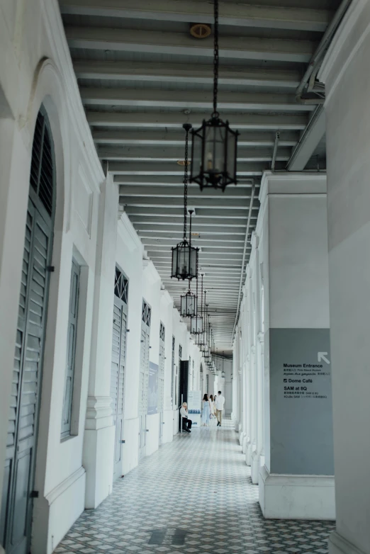 an open hallway at the museum with lights and decorative objects