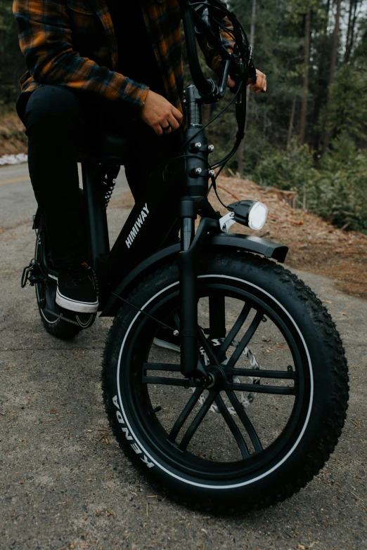 a man is riding a motorcycle on the road