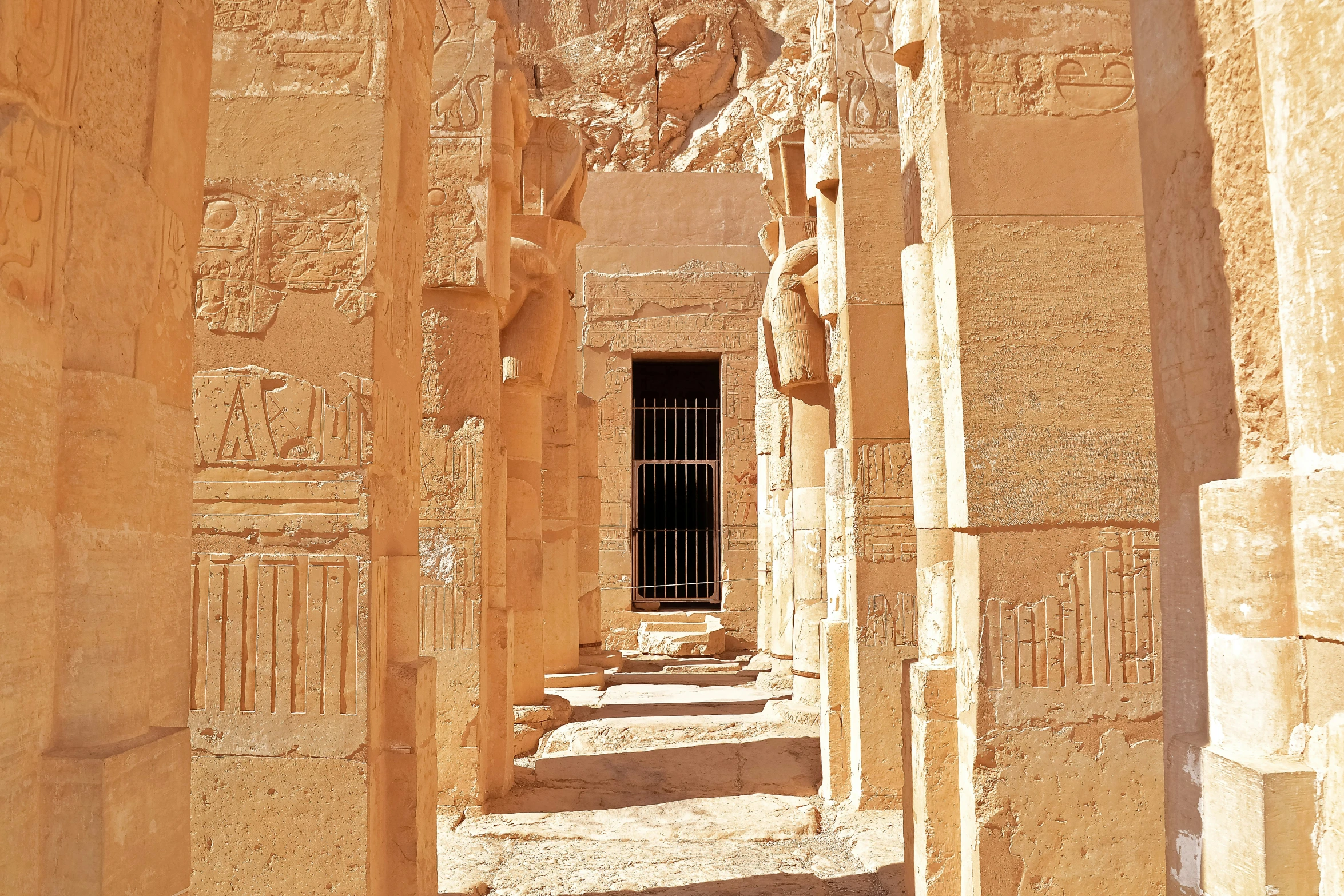 an ancient egyptian building with columns and reliefs