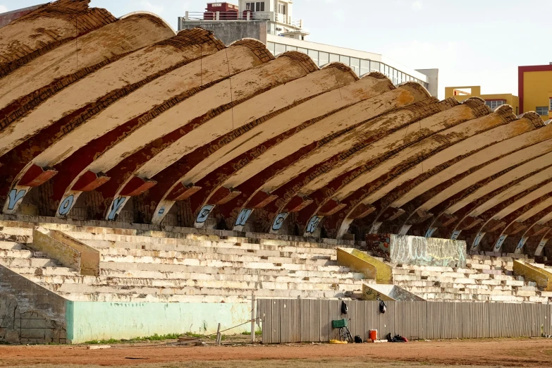 a big structure made of wood with benches next to it