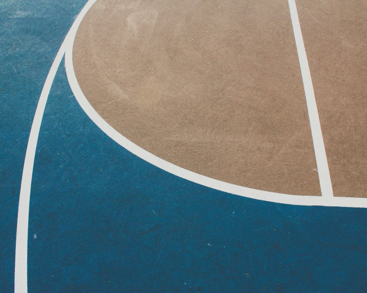 a basketball court has blue and brown lines