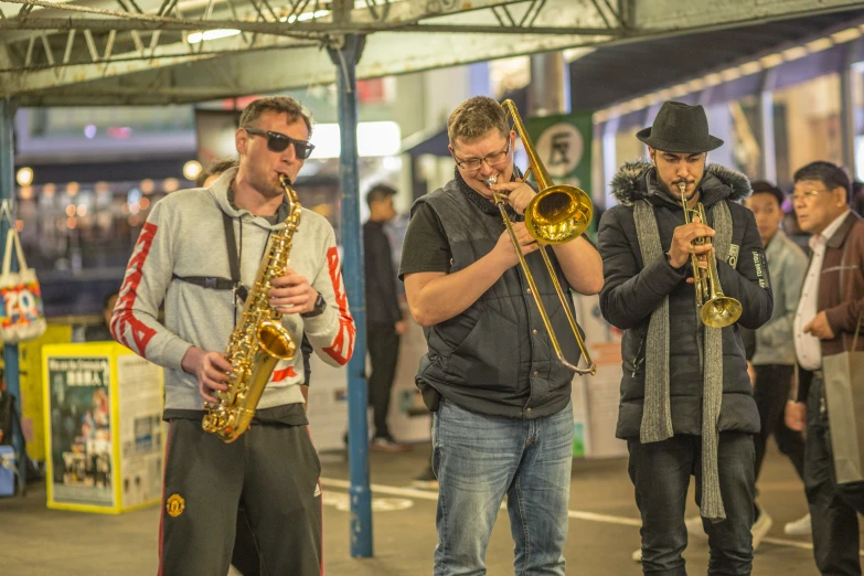 a group of men holding instruments in their hands