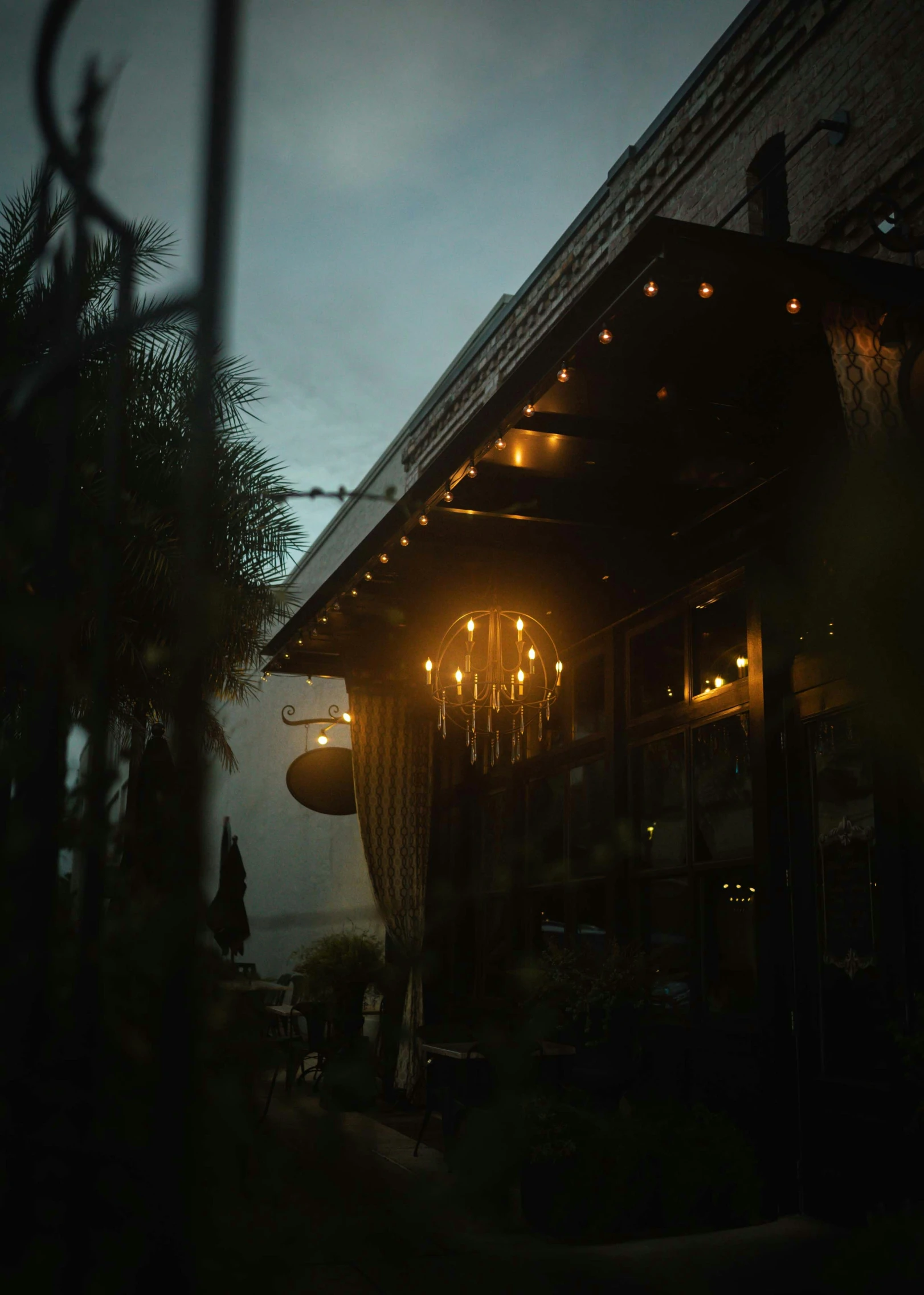 a nighttime view of a restaurant and patio