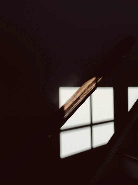 sunlight shining through the window onto a staircase