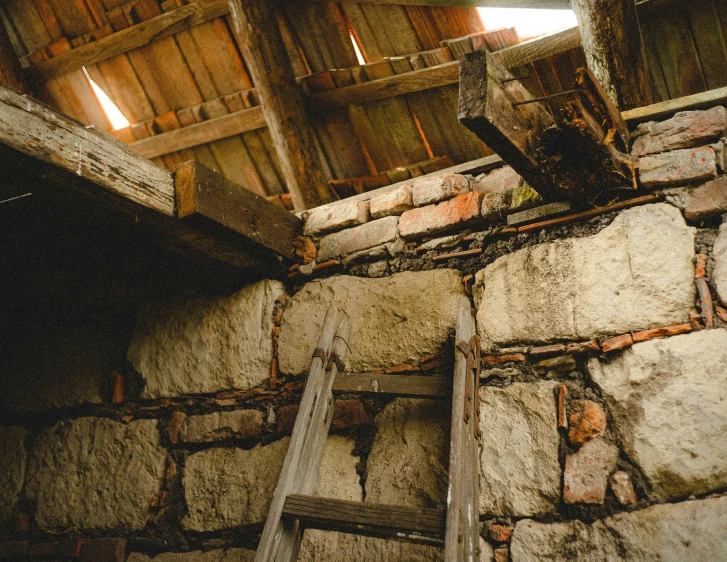 a wood ladder is hanging from the roof