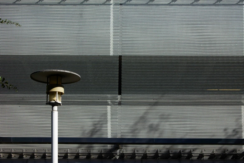 a street light is standing alone on a pole